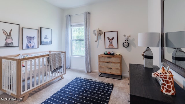 9624 Reserve Blvd, Biloxi, MS 39532 - carpeted bedroom featuring a nursery area and baseboards