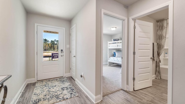 9624 Reserve Blvd, Biloxi, MS 39532 - doorway featuring light wood finished floors and baseboards
