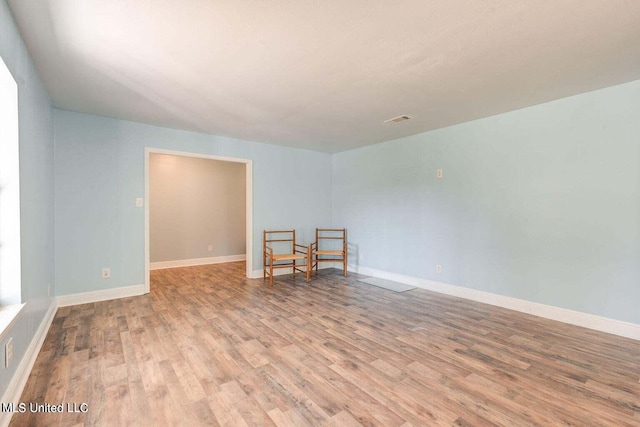 spare room featuring light wood-type flooring