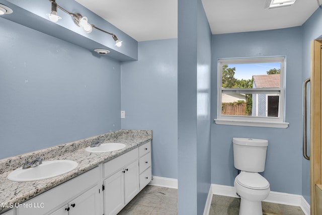 bathroom with vanity and toilet