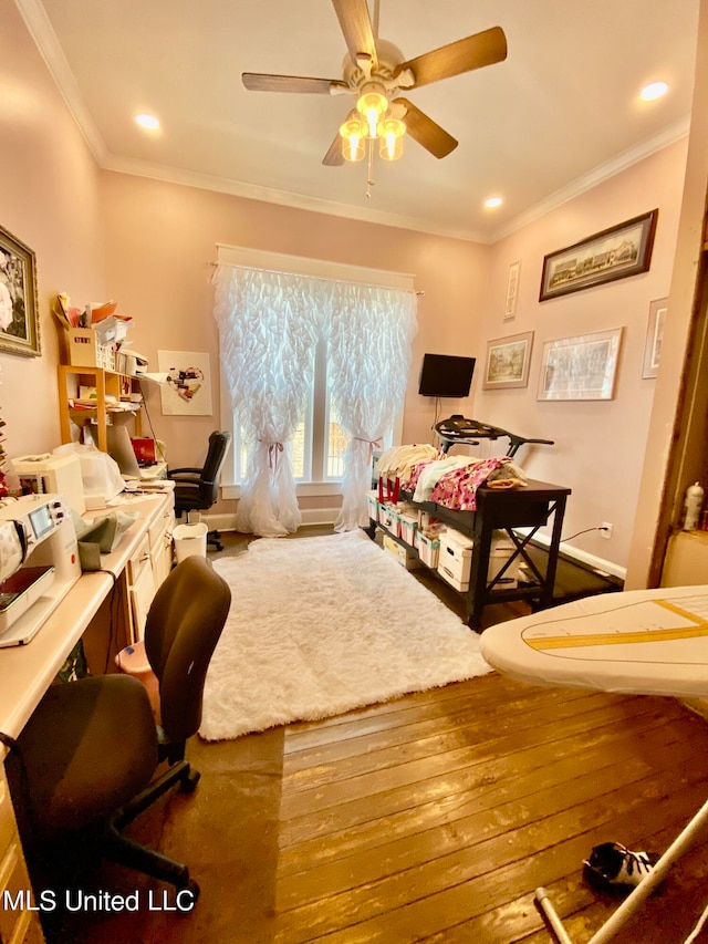 bedroom featuring ornamental molding, hardwood / wood-style flooring, and ceiling fan