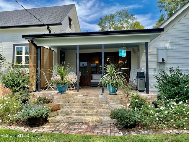 back of property with covered porch