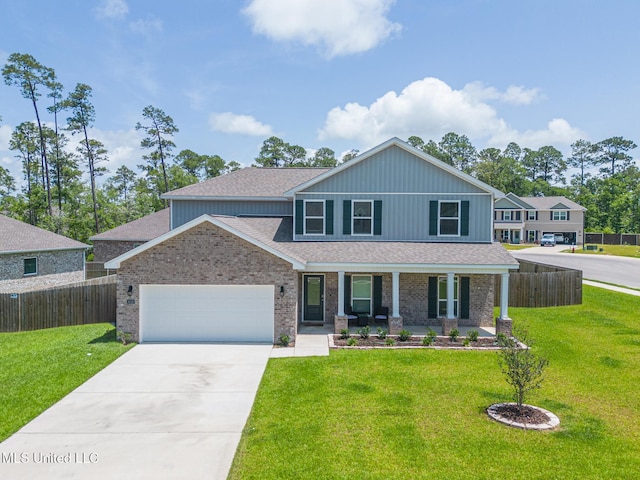 6016 Penni Ln, Ocean Springs, MS 39564 - view of front of house featuring a porch, an attached garage, driveway, brick siding, and roof with shingles