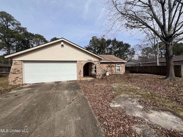 ranch-style house featuring a garage