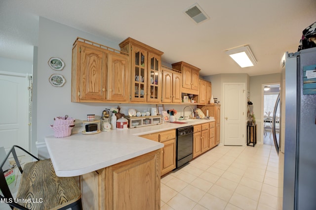 kitchen with a peninsula, visible vents, light countertops, freestanding refrigerator, and dishwasher