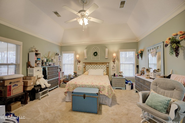 bedroom with visible vents, vaulted ceiling, crown molding, and light colored carpet