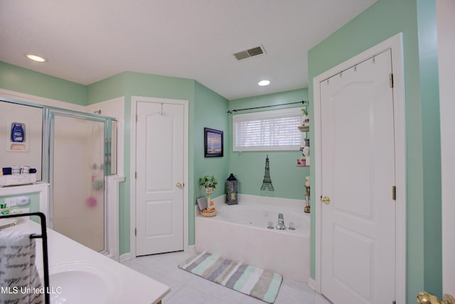 bathroom with a garden tub, recessed lighting, visible vents, a stall shower, and tile patterned flooring