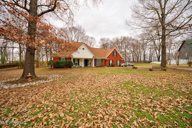 view of front of property with a porch and brick siding