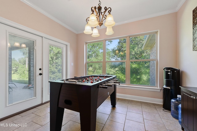 game room featuring crown molding, a chandelier, and light tile patterned floors