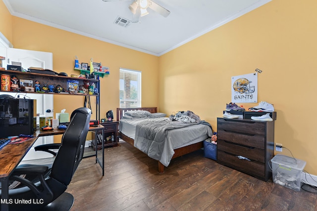 bedroom with ceiling fan, ornamental molding, and dark hardwood / wood-style floors