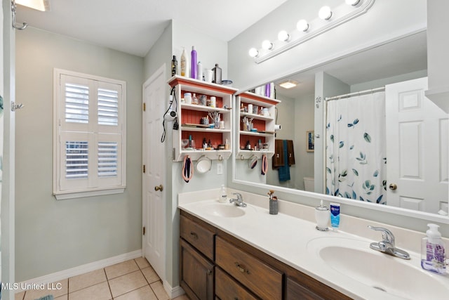 bathroom with tile patterned flooring, vanity, curtained shower, and toilet