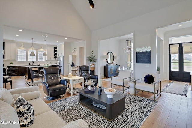 113 Forestview Pl, Madison, MS 39110 - living room with light wood finished floors, high vaulted ceiling, recessed lighting, and a chandelier