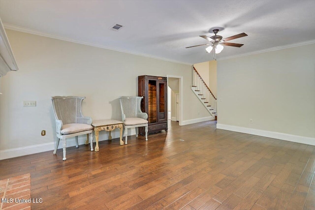 1507 W Flowers Rd, Terry, MS 39170 - living area with stairway, ceiling fan, wood finished floors, crown molding, and baseboards