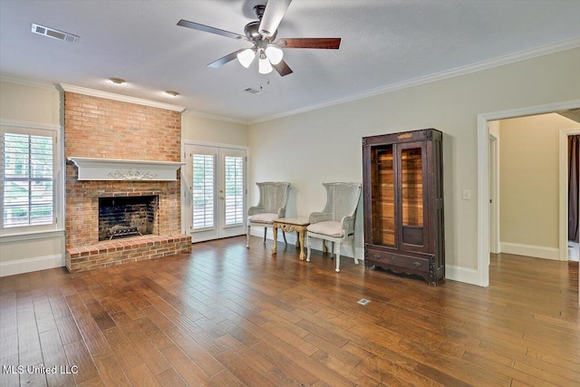 1507 W Flowers Rd, Terry, MS 39170 - living area with wood-type flooring, ceiling fan, baseboards, french doors, and crown molding