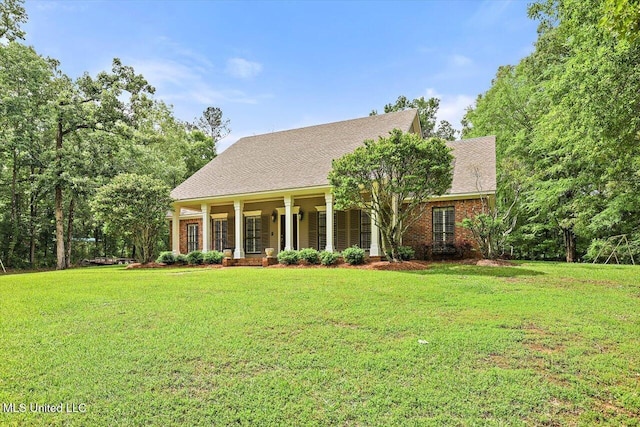1507 W Flowers Rd, Terry, MS 39170 - view of front facade featuring covered porch and a front yard