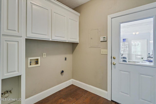 1507 W Flowers Rd, Terry, MS 39170 - clothes washing area with washer hookup, hookup for an electric dryer, dark wood-style flooring, baseboards, and cabinet space