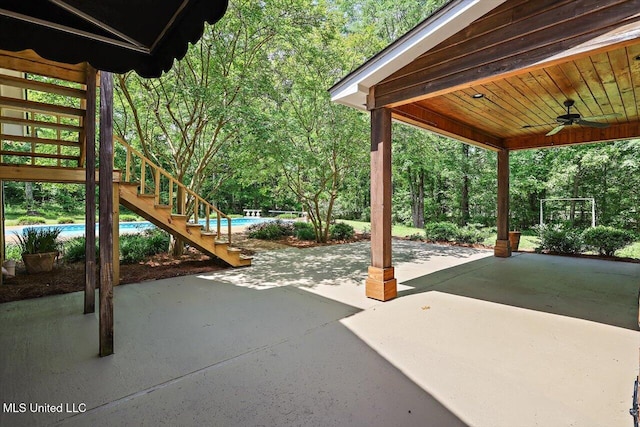 1507 W Flowers Rd, Terry, MS 39170 - view of patio / terrace featuring stairway, a ceiling fan, and an outdoor pool