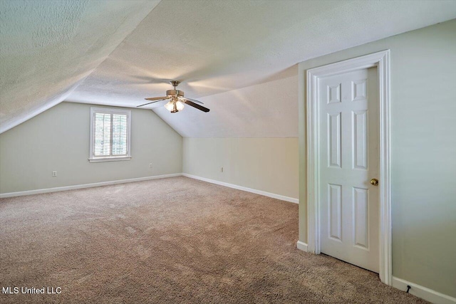 1507 W Flowers Rd, Terry, MS 39170 - bonus room with carpet, ceiling fan, vaulted ceiling, baseboards, and a textured ceiling