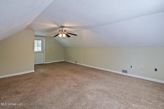 1507 W Flowers Rd, Terry, MS 39170 - additional living space with carpet floors, vaulted ceiling, a ceiling fan, and baseboards