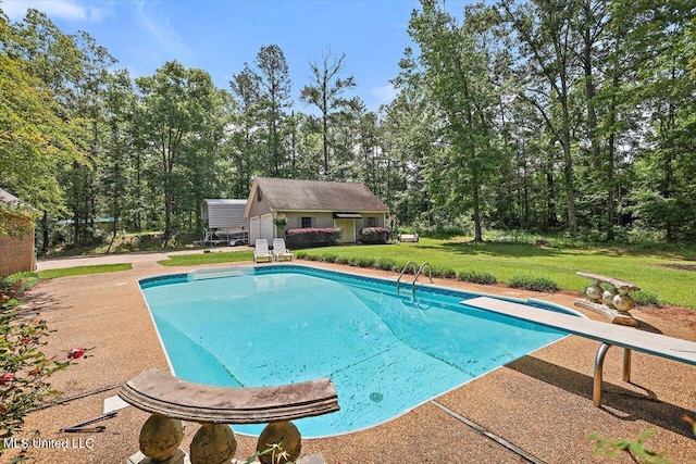 1507 W Flowers Rd, Terry, MS 39170 - swimming pool featuring a diving board, a yard, an outbuilding, and a patio area
