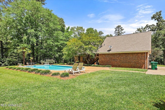 1507 W Flowers Rd, Terry, MS 39170 - outdoor pool with a yard, a patio, a diving board, and view of scattered trees