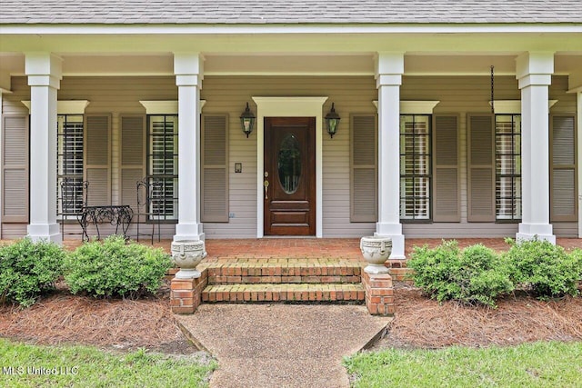 1507 W Flowers Rd, Terry, MS 39170 - view of exterior entry featuring covered porch and a shingled roof