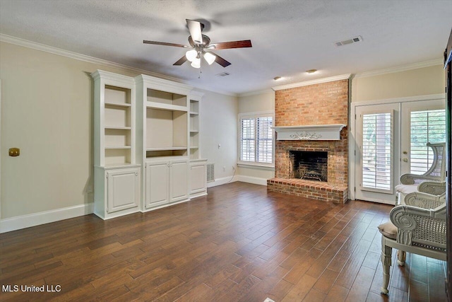 1507 W Flowers Rd, Terry, MS 39170 - unfurnished living room featuring ceiling fan, dark wood-style floors, a brick fireplace, baseboards, and ornamental molding