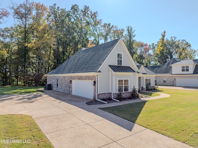 view of front of property with central AC, a garage, and a front lawn