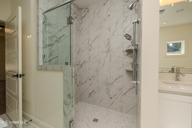 bathroom with vanity and an enclosed shower