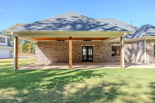 rear view of house featuring a lawn, ceiling fan, a patio area, and french doors