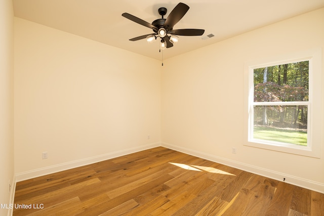 spare room with ceiling fan and light hardwood / wood-style flooring