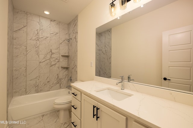 full bathroom featuring tiled shower / bath combo, toilet, and vanity