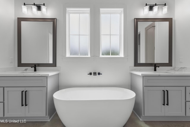 217 White Harbor Rd, Long Beach, MS 39560 - bathroom featuring a sink, two vanities, and a soaking tub