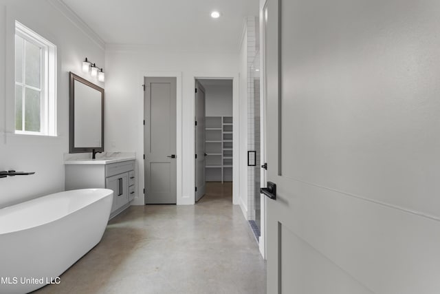 217 White Harbor Rd, Long Beach, MS 39560 - full bath with finished concrete floors, vanity, a spacious closet, ornamental molding, and a soaking tub