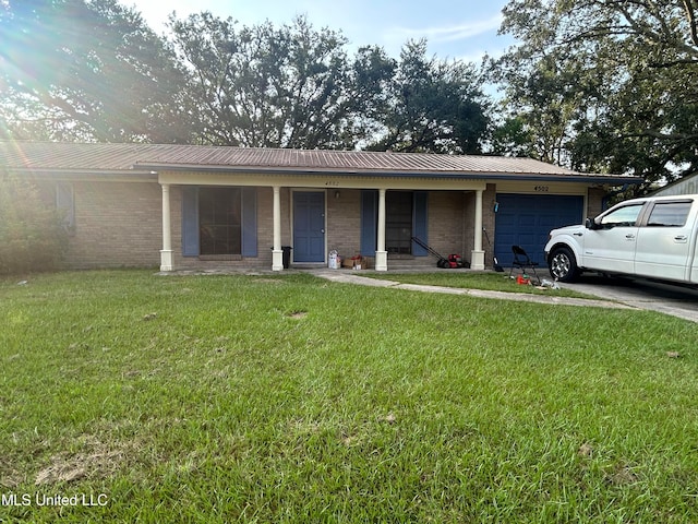 ranch-style house with a front yard, covered porch, and a garage