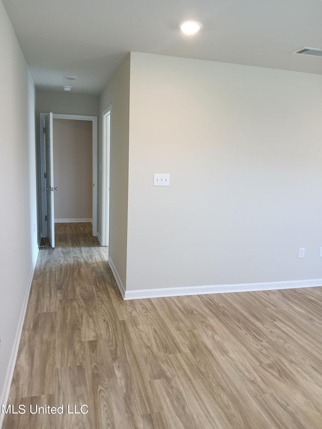 hall with light hardwood / wood-style floors