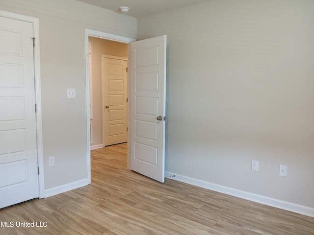 unfurnished bedroom featuring light hardwood / wood-style flooring