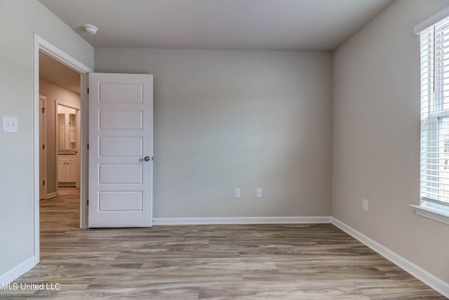 unfurnished room featuring light wood-type flooring