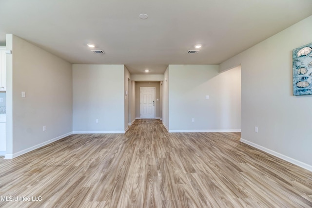 unfurnished room featuring light hardwood / wood-style floors