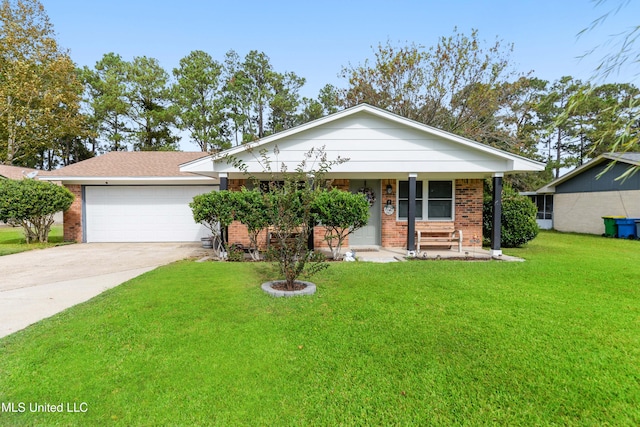 single story home with covered porch, a garage, and a front yard