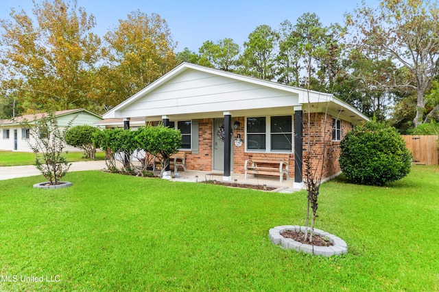 view of front of house with a porch and a front yard