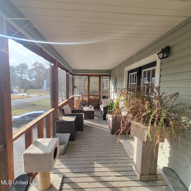 wooden deck with an outdoor hangout area