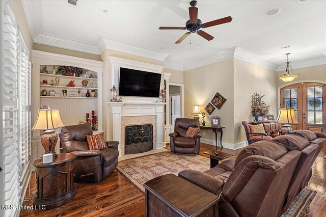 living room featuring a fireplace with flush hearth, ceiling fan, ornamental molding, dark wood-type flooring, and french doors