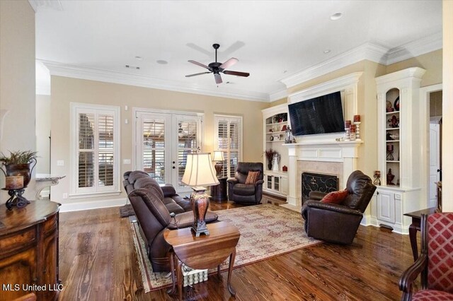 living area featuring crown molding, a fireplace with flush hearth, french doors, and dark wood-style flooring