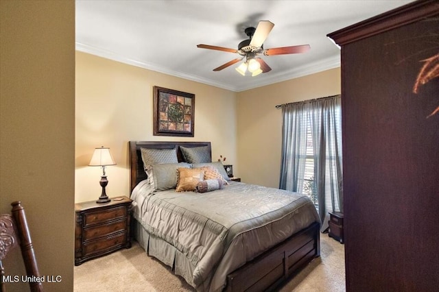 bedroom featuring a ceiling fan, crown molding, and light colored carpet