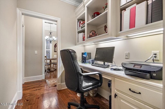 office with dark wood-type flooring, a notable chandelier, and baseboards