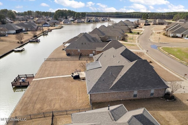 birds eye view of property featuring a residential view and a water view