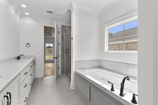 bathroom featuring vanity, ornamental molding, shower with separate bathtub, and tile patterned flooring