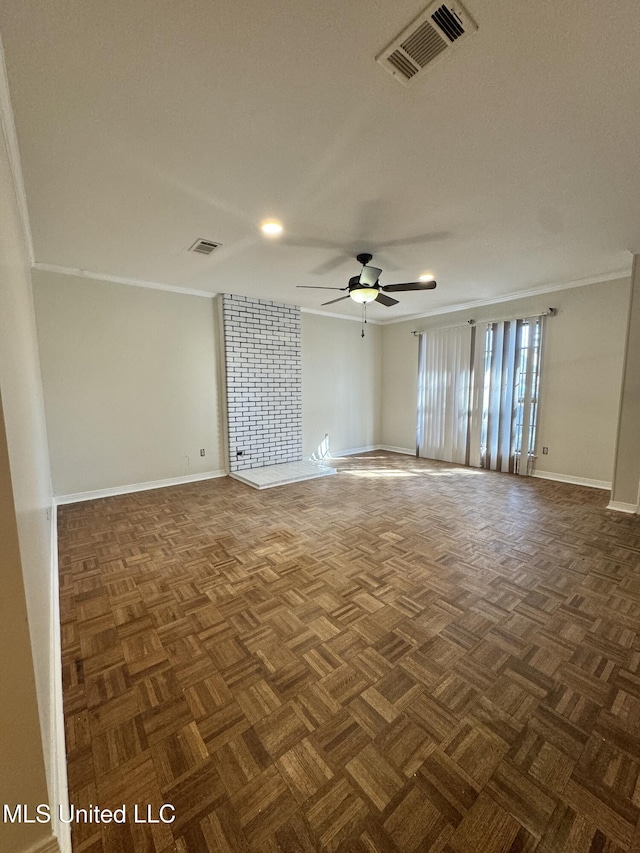 empty room featuring baseboards, visible vents, a ceiling fan, and ornamental molding