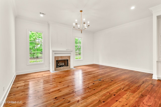 unfurnished living room featuring crown molding, light hardwood / wood-style flooring, and a fireplace